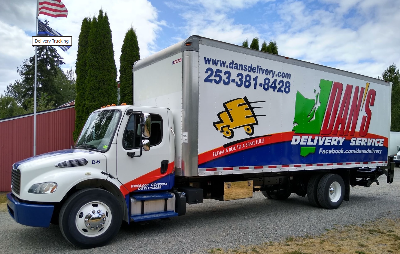 Exactly How to Prepare Your FTL Shipments for May Inspections Close up shot of a Dan's Delivery freight truck | FTL Shipments