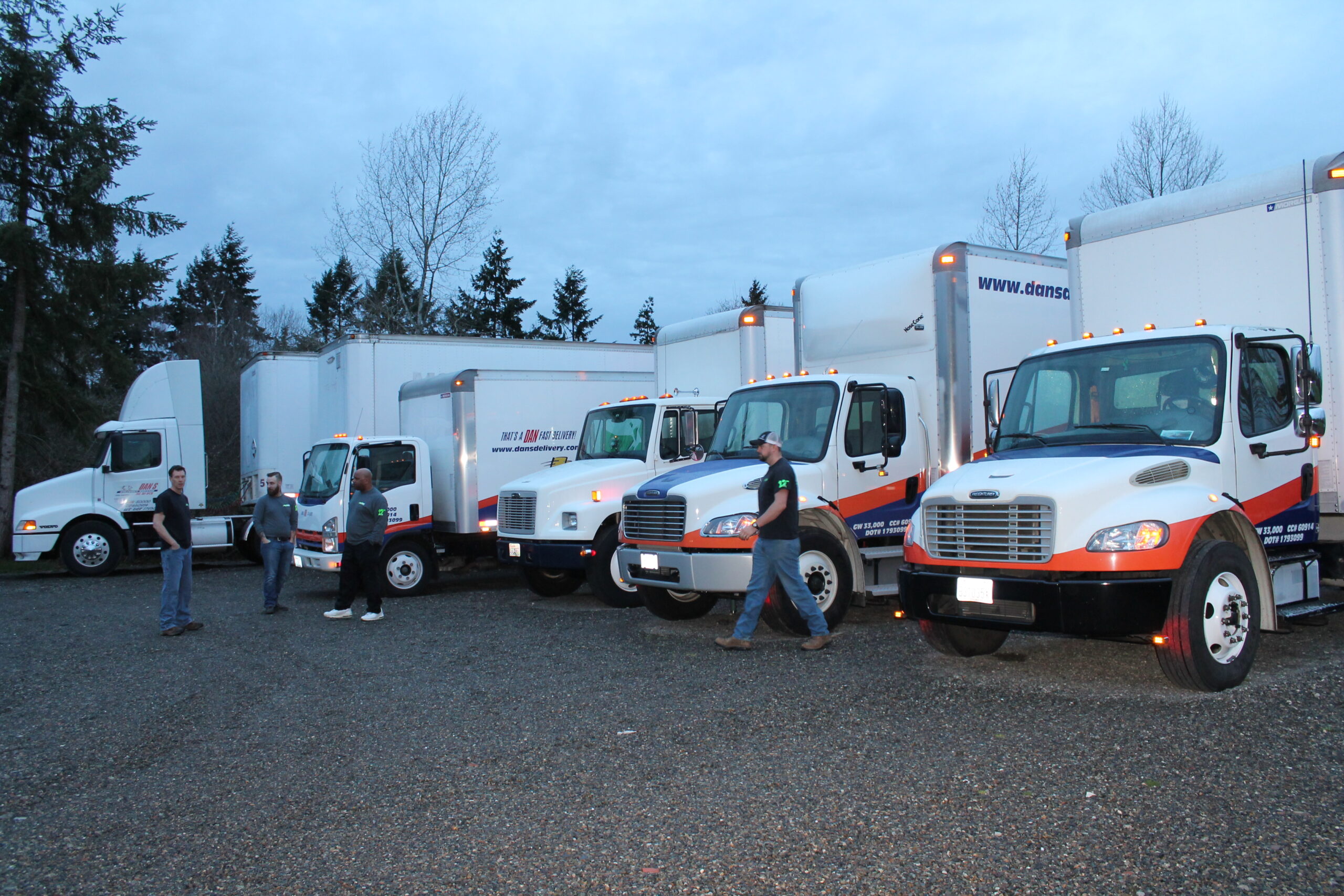 Why Washington Shippers Feel the Squeeze of May Produce Season Dan's Delivery workers standing outside of their fleet of trucks | Washington shippers
