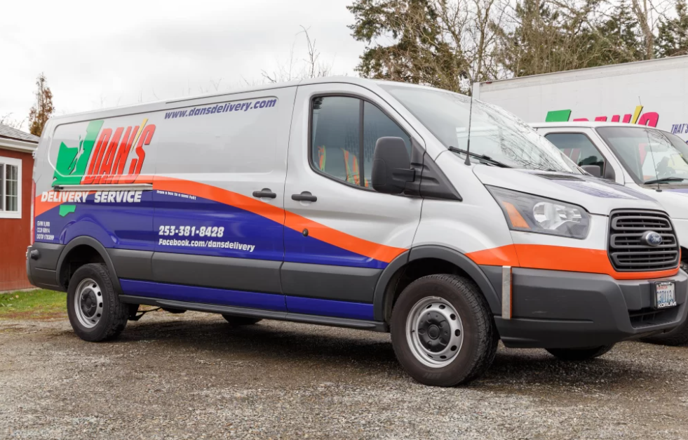 The Smarter Summer Ship: How LTL Shipping Consolidation Lowers High July Fuel Costs close up picture of a Dan's Delivery van